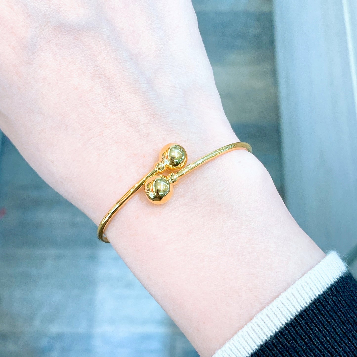 Polished Double Ball Hollow Twist Bangle - Oval